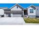 Charming two-story home with a two-car garage, well-manicured lawn, and beautiful curb appeal at 5925 La Posada Pl, Parker, CO 80134