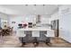 Contemporary kitchen with an island, stainless steel appliances, and open to the dining area at 5925 La Posada Pl, Parker, CO 80134