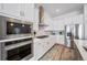 Well-equipped kitchen with stainless steel appliances, granite countertops, and ample cabinetry at 5925 La Posada Pl, Parker, CO 80134