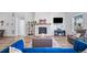 Inviting living room featuring a fireplace, TV, and comfortable seating arrangements at 5925 La Posada Pl, Parker, CO 80134