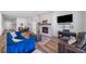 Spacious living area with fireplace, piano, and stylish decor for relaxation at 5925 La Posada Pl, Parker, CO 80134