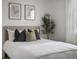 Comfortable bedroom featuring a plush bed with stylish throw pillows and neutral decor at 5347 Warrior St, Frederick, CO 80504