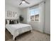 Serene bedroom with large window, plush rug, and contemporary decor for relaxation at 5347 Warrior St, Frederick, CO 80504