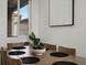 Dining room featuring a wood table set with place settings and a decorative plant at 5347 Warrior St, Frederick, CO 80504