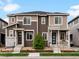 Well-kept townhome featuring two-tone siding, stone accents, and inviting front porches at 5347 Warrior St, Frederick, CO 80504