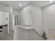 Bright hallway featuring a staircase and doorways leading to other rooms in the house at 5347 Warrior St, Frederick, CO 80504