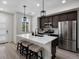 Modern kitchen featuring stainless steel appliances, white countertops and an island with seating at 5347 Warrior St, Frederick, CO 80504