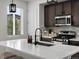 Bright kitchen with white countertops, stainless steel appliances, and a modern faucet at 5347 Warrior St, Frederick, CO 80504