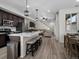 Modern kitchen with stainless steel appliances, an island with seating, and an open layout at 5347 Warrior St, Frederick, CO 80504