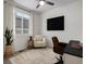 Bright office featuring a window, armchair, desk, office chair, and decorative rug at 5347 Warrior St, Frederick, CO 80504