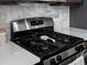 Close-up of kitchen stove with stainless steel appliances and sleek design at 5347 Warrior St, Frederick, CO 80504