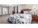 Cozy bedroom featuring a decorative floral bedspread, warm lighting, and a tranquil ambiance at 1748 W Tennessee Ave, Denver, CO 80223