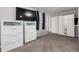 Well-lit bedroom offers soft carpet, ample storage, and modern media setup for comfort at 1748 W Tennessee Ave, Denver, CO 80223