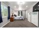 Inviting bedroom with plush carpet, ample natural light, and calming neutral tones at 1748 W Tennessee Ave, Denver, CO 80223