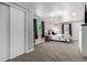 Spacious bedroom with neutral walls, soft carpeting, and double windows offers a serene retreat at 1748 W Tennessee Ave, Denver, CO 80223