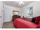 Comfortable bedroom with natural light, traditional furniture, and soft carpet at 1748 W Tennessee Ave, Denver, CO 80223