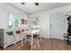Well-lit dining area featuring hardwood floors, natural light, and traditional decor at 1748 W Tennessee Ave, Denver, CO 80223