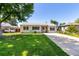 Charming single-story home with a well-manicured lawn and inviting curb appeal at 1748 W Tennessee Ave, Denver, CO 80223