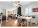 Bright living room features hardwood floors, a modern fireplace and abundant natural light at 1748 W Tennessee Ave, Denver, CO 80223