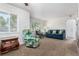 Cozy living room featuring plush carpeting, neutral walls, and comfortable seating arrangements at 1748 W Tennessee Ave, Denver, CO 80223
