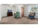 Cozy living room featuring plush carpeting, neutral walls, and comfortable seating arrangements at 1748 W Tennessee Ave, Denver, CO 80223