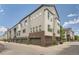 Modern townhome showcasing contemporary design, multiple stories, and convenient garage access at 467 S Reed Ct, Lakewood, CO 80226