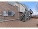 Brick patio with staircase to upper level, providing an excellent outdoor living space at 11237 W 55Th Ln, Arvada, CO 80002