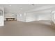 Large basement with neutral carpet and recessed lights offers ample space for recreation and storage at 11237 W 55Th Ln, Arvada, CO 80002