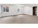 Unfinished basement with natural light, carpet flooring, and potential for customization at 11237 W 55Th Ln, Arvada, CO 80002