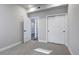 Neutral bedroom featuring carpet, white trim, an open doorway, and a double door closet at 1208 N Quitman St # 402, Denver, CO 80204