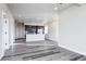 Spacious open-concept living room adjacent to modern kitchen and filled with natural light at 1208 N Quitman St # 402, Denver, CO 80204
