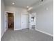 Carpeted main bedroom with closet and ensuite bathroom access at 1208 N Quitman St # 402, Denver, CO 80204