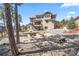 Large backyard features a patio, firepit, and a spacious lawn perfect for outdoor gatherings at 16231 Thunder Cat Way, Monument, CO 80132