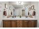 Bathroom featuring a double vanity with dark wood cabinets and a white countertop at 16231 Thunder Cat Way, Monument, CO 80132