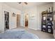 Comfortable bedroom with open closet and views into the ensuite bathroom at 16231 Thunder Cat Way, Monument, CO 80132