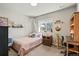 Cozy bedroom with lots of natural light, a desk, and decorative accents at 16231 Thunder Cat Way, Monument, CO 80132