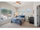 Inviting bedroom with ceiling fan and large window with views at 16231 Thunder Cat Way, Monument, CO 80132