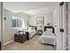 Comfortable bedroom with two twin beds, artwork, and a window that fills the space with natural light at 16231 Thunder Cat Way, Monument, CO 80132