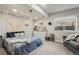 Bedroom with a large window, string lights, and a comfortable seating area at 16231 Thunder Cat Way, Monument, CO 80132