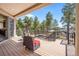 Outdoor deck overlooking the backyard, featuring beautiful views and comfortable seating at 16231 Thunder Cat Way, Monument, CO 80132