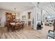 Elegant dining room features wood floors and transitional decor flowing into living area at 16231 Thunder Cat Way, Monument, CO 80132