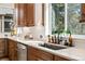 Eat-in kitchen features wooden cabinets, light countertops and stainless steel appliances at 16231 Thunder Cat Way, Monument, CO 80132