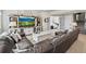 Living area features a large entertainment center and french doors leading to a bedroom at 16231 Thunder Cat Way, Monument, CO 80132