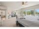 Main bedroom suite with a sitting area and views of the trees outside at 16231 Thunder Cat Way, Monument, CO 80132
