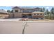 Elegant home showcasing beautiful stone accents, a welcoming porch, and a three-car garage on a well-manicured lot at 16231 Thunder Cat Way, Monument, CO 80132