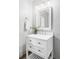 Stylish bathroom with a white vanity, framed mirror, and decorative lighting at 1908 Taft Dr, Lakewood, CO 80215