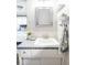 Bathroom vanity with a white sink and counter, white cabinet, and decor at 1908 Taft Dr, Lakewood, CO 80215