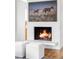 Cozy fireplace with a rustic hearth and mantle, perfect for a comfortable and inviting space at 1908 Taft Dr, Lakewood, CO 80215
