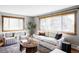 Comfortable living room with hardwood floors, natural lighting and neutral decor, providing a welcoming atmosphere at 1908 Taft Dr, Lakewood, CO 80215