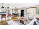 Spacious open concept living room with modern kitchen, dining, and multiple seating areas at 1908 Taft Dr, Lakewood, CO 80215